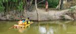 People coming in bamboo raft to post Flood Health camp, Udalguri